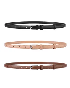 Close-up of three thin leather belts for women in black, beige and brown with pin buckles