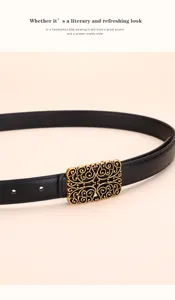 Close-up of vintage gold filigree buckle on a black leather belt for women.