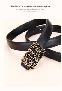Macro view showing the intricate vintage gold filigree buckle on a black leather belt