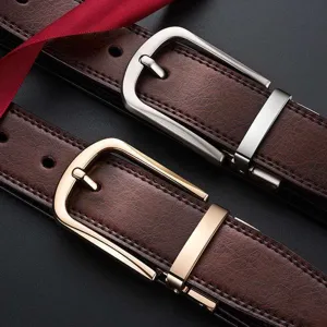 Men's textured brown leather belts with classic gold and silver-toned pin buckles.