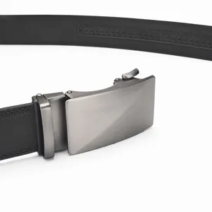 Detailed macro view of a men's black leather belt featuring a brushed grey automatic buckle