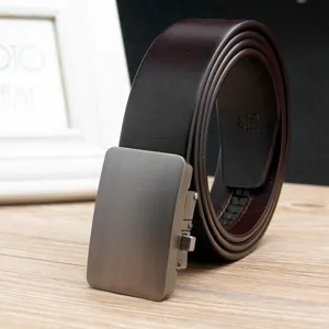 Close-up detail of a dark brown leather belt with a brushed metal automatic buckle.