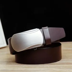 Macro view of brushed silver automatic buckle on premium brown cowhide leather belt
