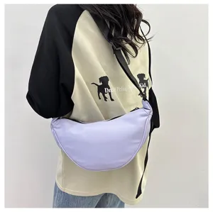 Minimalist purple nylon crescent crossbody bag worn by model for casual fashion