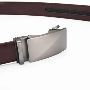 Detailed macro shot of a men's brown genuine leather belt with a matte silver automatic buckle.