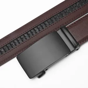 Detailed view of men's brown leather belt with a sleek matte black automatic buckle