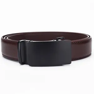 Macro detail of high-quality brown leather belt for men featuring a matte black automatic buckle