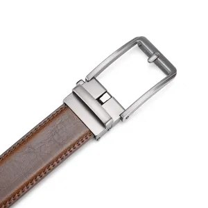 Close-up macro view of high-quality brown leather belt with gunmetal automatic buckle