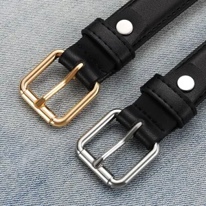 Minimalist women's black faux leather belts with gold and silver square buckles.
