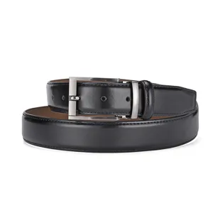 Close-up of a classic black leather belt with a brushed metal needle buckle
