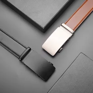 Close-up of black and brown men's genuine leather belts with sleek automatic buckles