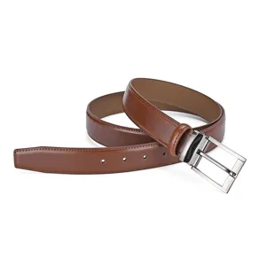 Close-up of a brown genuine cowhide leather belt with a polished silver needle buckle