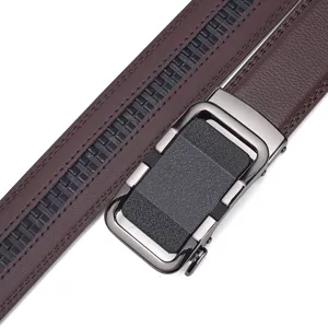 Detailed macro shot of a men's brown leather belt with a metal automatic buckle