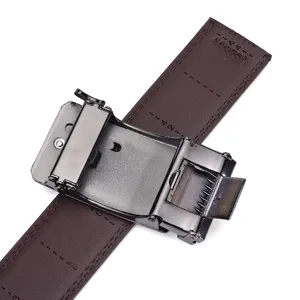 Macro view of a premium automatic belt buckle showing the internal mechanism and leather.