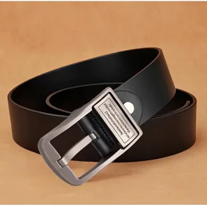 Close-up of black leather men's belt with silver-toned pin buckle and engraved detail