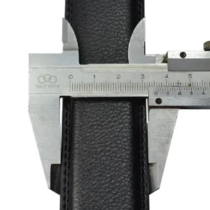 Detailed close-up showing black leather belt width measurement with a vernier caliper