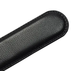 Macro detail of the black split cowhide leather men's belt strap showing fine stitching.