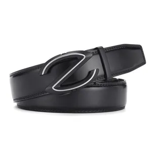 Macro view of a premium black cowhide leather belt featuring a sleek Z-shaped automatic buckle