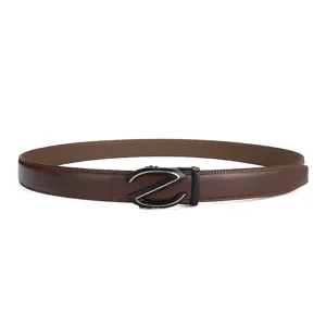 Macro view of brown leather belt featuring a sleek black and gold Z-style automatic buckle