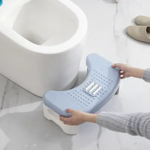 Ergonomic blue toilet stool with massage rollers for an improved bathroom posture