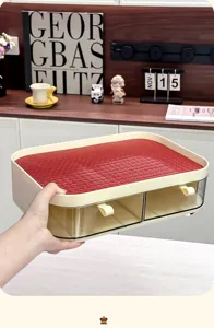 Premium desktop storage box with two clear drawers and red woven top being held by hand