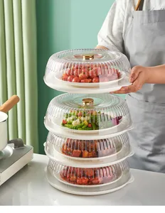 Stackable transparent food covers showing a multi-layer storage solution for dishes.