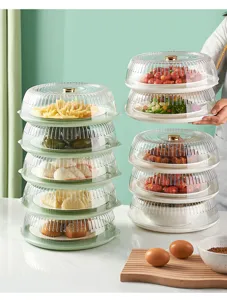 Detail showing stackable transparent food covers for multi-layer dining table storage