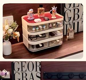 Cream desktop storage organizer with 3 transparent drawers on a wooden entryway table.