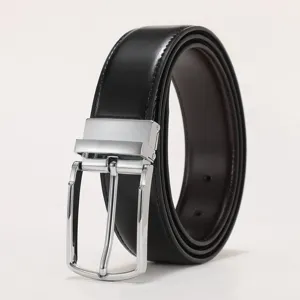 Close-up of classic silver pin buckle on premium black leather men's dress belt