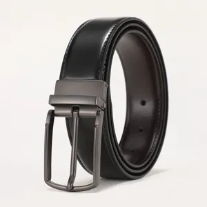 Close-up detail of men's genuine leather belt featuring a sleek matte gunmetal pin buckle