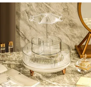 Close-up of a rotating cosmetic organizer with a unique umbrella-shaped jewelry stand.