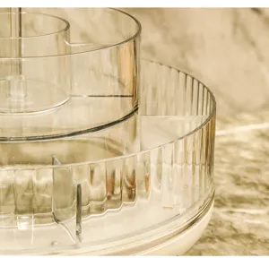 Close-up of transparent rotating cosmetic organizer with vertical ribbed texture