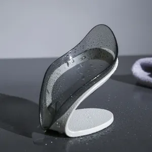 Elegante jabonera minimalista en forma de hoja para baño con diseño de drenaje