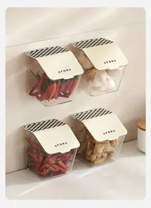 Set of four wall-mounted flip-top kitchen storage boxes holding fresh ginger and garlic