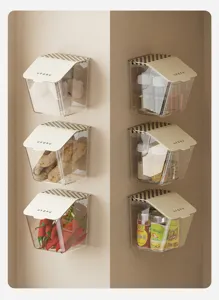 Six wall-mounted transparent storage boxes with flip lids holding kitchen spices