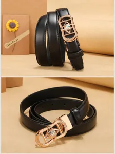 Detailed view of women's black leather belt with ornate gold rhinestone buckle