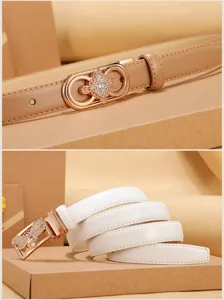 Close-up detail of women's genuine leather thin belts with crystal encrusted buckles