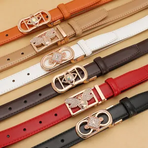 Fashionable genuine leather thin belts for women featuring ornate rhinestone buckles