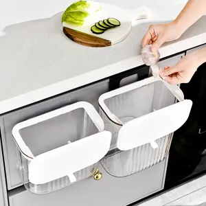 Cubos de basura de cocina transparentes de pared con tapas blancas en gabinete
