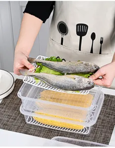 Rectangular clear fridge storage box with lid and white drainage tray for fresh fish