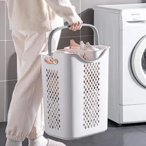 Modern portable white laundry basket with dual compartments for bathroom clothes storage
