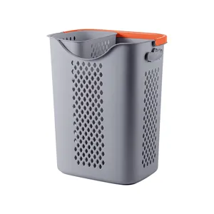 Modern grey plastic laundry basket with orange rim and internal partition for sorting clothes