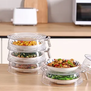 Stackable transparent plastic food covers for kitchen table dust and fly protection.