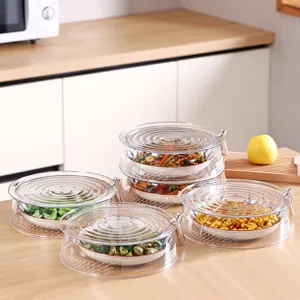 Stackable transparent food covers with breathable hollow design for kitchen use.