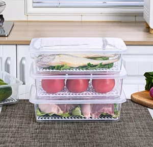Stackable clear plastic refrigerator storage containers with interior drain plates