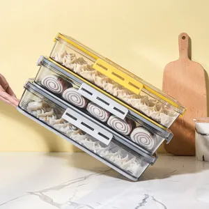 Cajas de almacenamiento apilables de PET transparentes para organizar dumplings.