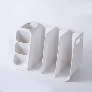 Close-up detail of white multi-compartment plastic desk organizer for files and pens