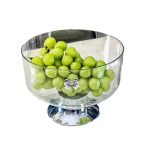 Élégant bol à fruits transparent avec pied haut et nœud argenté pour décoration intérieure