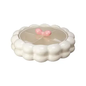 Cream white round segmented candy snack storage box with cute pink bow handle and clear lid