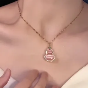 Elegant pink cat's eye gourd pendant necklace with gold chain for women's jewelry